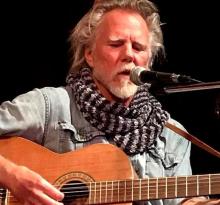 John-Michael Field (JAMOOF) playing guitar