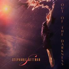 Stephanie Bettman underwater on the cover of her album, Out of the Darkness