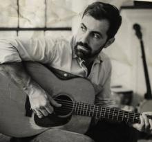 Billy Simons, Jr, with his guitar