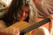 photo of Mary Shapiro playing guitar