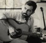Billy Simons, Jr, with his guitar