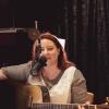 Marie Hopkinson playing guitar